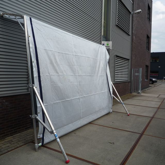 Free-standing tarpaulin