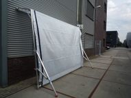 Free-standing tarpaulin